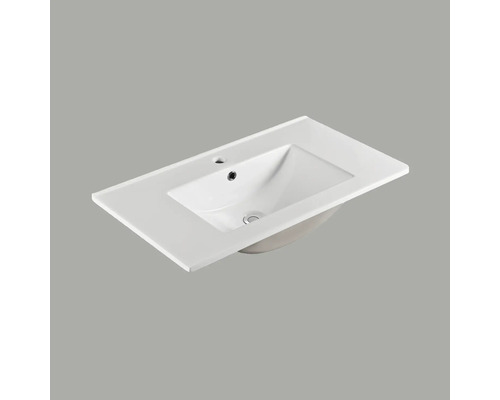 Tvättställ i keramik med kranhål och bräddavlopp