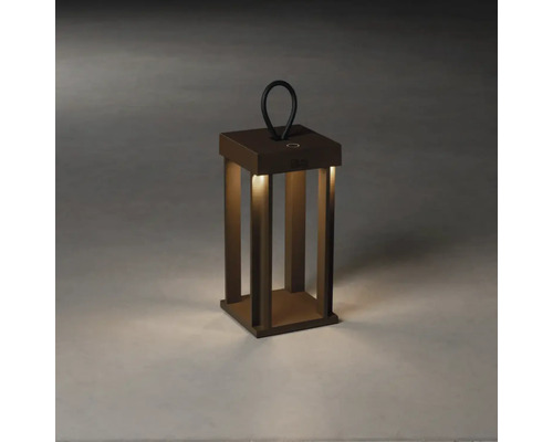 Dekorativ bronsfärgad lykta med handtag och belysning