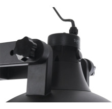Detaljbild av en svart lampa med vridknapp
