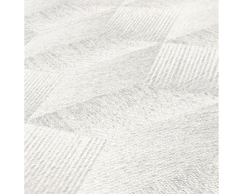 Närbild av en vit matta med geometriskt mönster