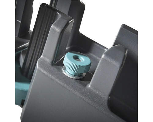 Detaljbild av en geringslåda med låsskruv