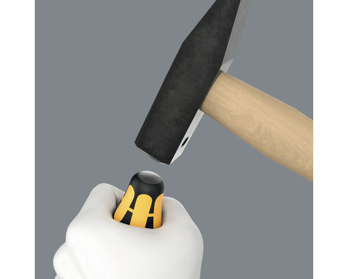 Hammare som slår på en bitshållare