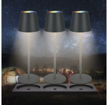 Tre bordslampor med färgskiftande ljus på en hållare