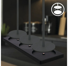 Tre lampor på ett svart fäste med symbol för magnetisk fastsättning