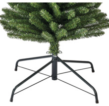 Närbild av en konstgjord julgran med metallstativ