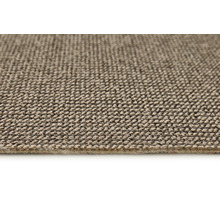 Närbild av en beige matta med textil struktur