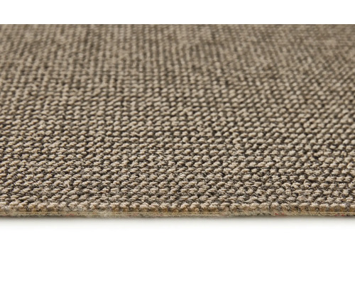 Närbild av en beige matta med textil struktur