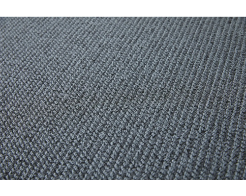 Närbild av en grå matta med textil struktur