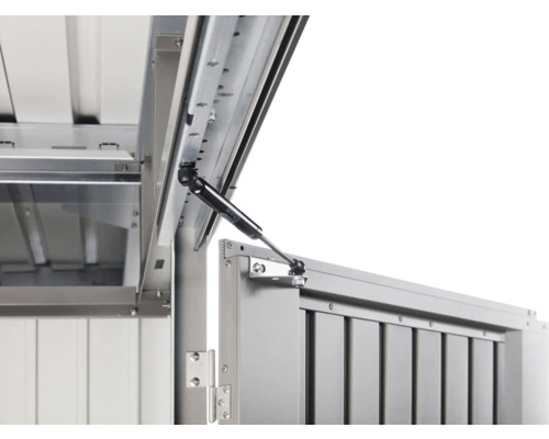 Detaljvy av en redskapslåda med gasfjäder för lockstöd.