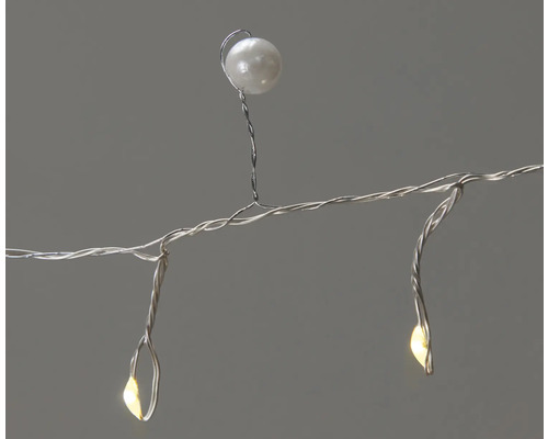 Dekorativ ljusslinga med tråd och pärla