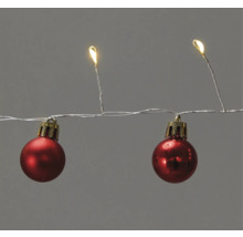 Ljusslinga med röda dekorationskulor