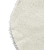Detaljvy av en beige läderfiberskiva