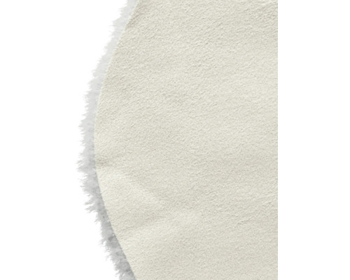 Detaljvy av en beige läderfiberskiva