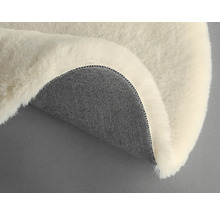 Dekorativt fårskinn med textilbaksida