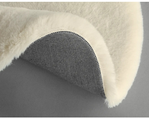 Dekorativt fårskinn med textilbaksida