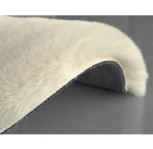 Detalj av en hög luggmatta med vävd baksida