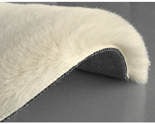 Detalj av en hög luggmatta med vävd baksida