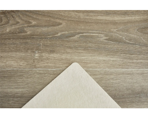 Beige matta underlag på trägolv