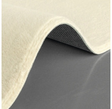 Detaljvy av en matta med lugg och vävd baksida