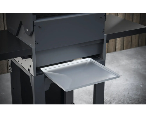 Detaljvy av en grill med förvaringsutrymme