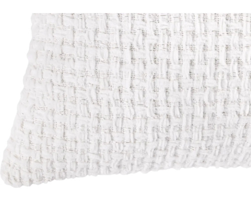 Vit dekorativ kudde med vävd textur