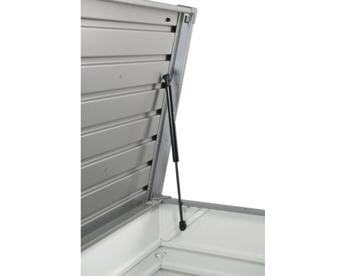 Detaljvy av ett öppnat verktygsskåp med gasfjäder