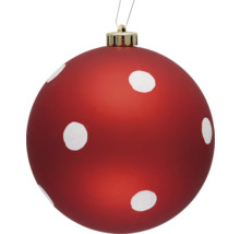 Röd julgranskula med vita prickar