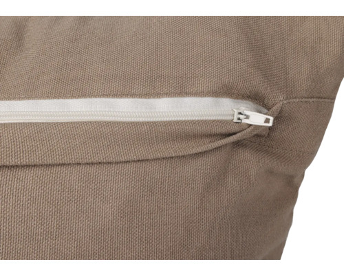 Närbild av en kudde med dragkedja