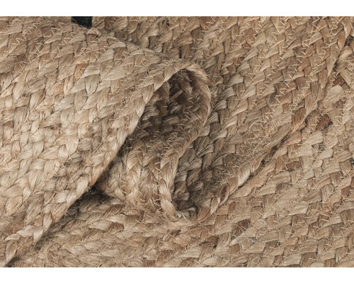 Närbild av en flätad matta av naturfiber.