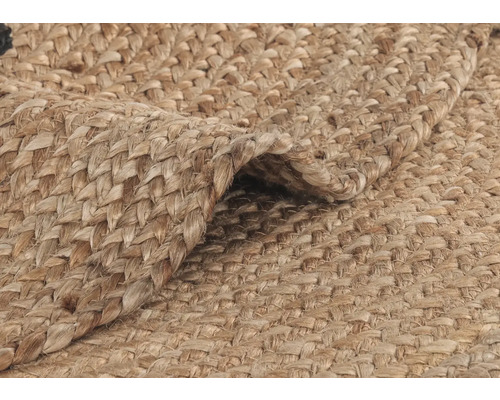 Detaljvy av en flätad matta av naturfiber