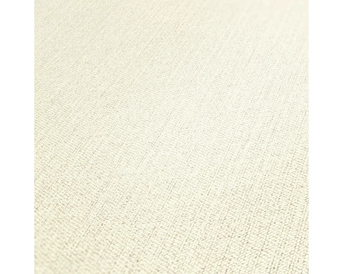 Närbild av en ljus textilväggbeklädnad med fin vävstruktur