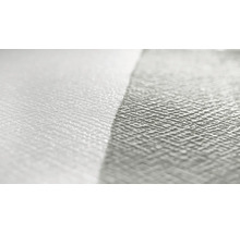 Närbild av en vit non-woven tapet med struktur