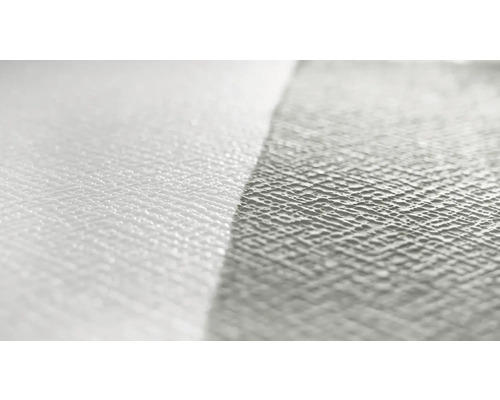 Närbild av en vit non-woven tapet med struktur