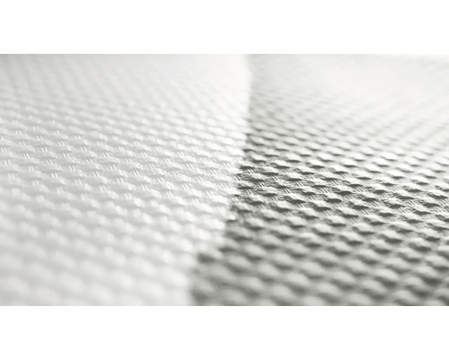 Närbild av ett vitt, vävt tyg med textur