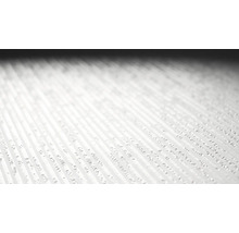 Närbild av en texturerad yta med upphöjda linjer
