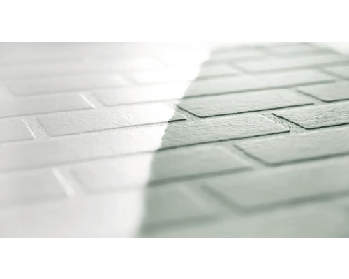 Närbild av en väggplatta i tegelstenslook