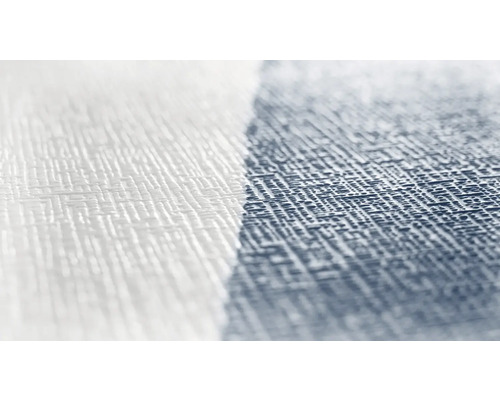 Närbild av en vit och en mönstrad tapet