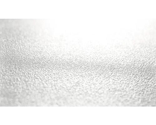 Närbild av en strukturerad, reflekterande yta