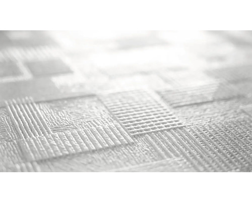 Närbild av en vit strukturtapet med ett kvadratiskt mönster