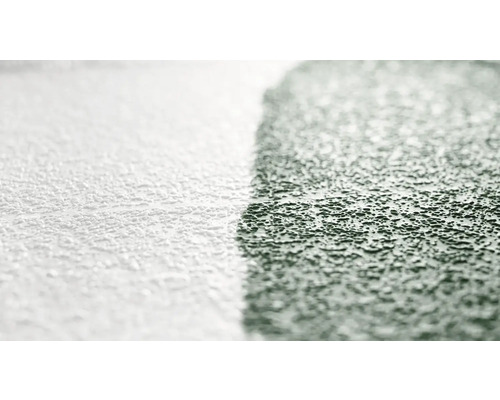 Närbild av en vägg med putsstruktur