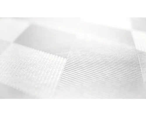 Närbild av ett vitt textilmaterial med ett schackrutigt mönster