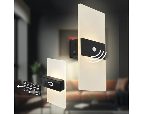 Två vägglampor med rörelsesensor och magnetisk fästning i ett vardagsrum.