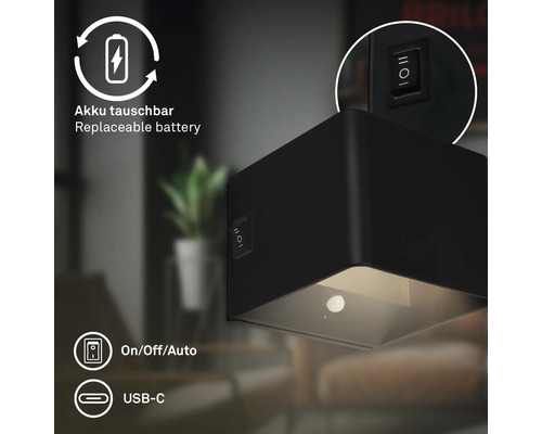 Svart LED-vägglampa med utbytbart batteri och USB-C-port