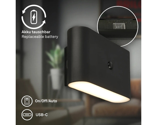 Svart vägglampa med utbytbart batteri, automatisk på-av och USB-C-anslutning.