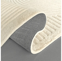 Detalj av en beige matta med geometriskt mönster