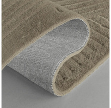 Matta med reliefstruktur och vävd baksida