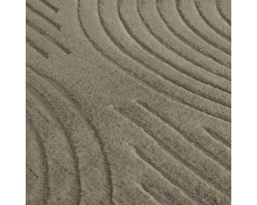 Närbild av en matta med vågigt mönster