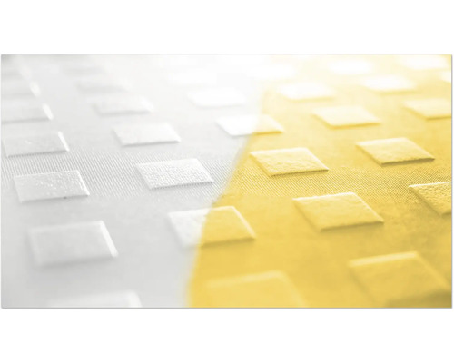 Närbild av en texturerad yta med upphöjt rombmönster