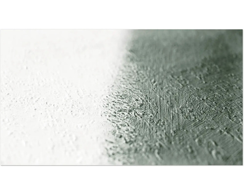 Närbild av en vägg med färg applicerad