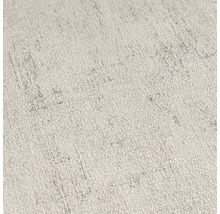 Närbild av en ljus, strukturerad tapet med fina mönster